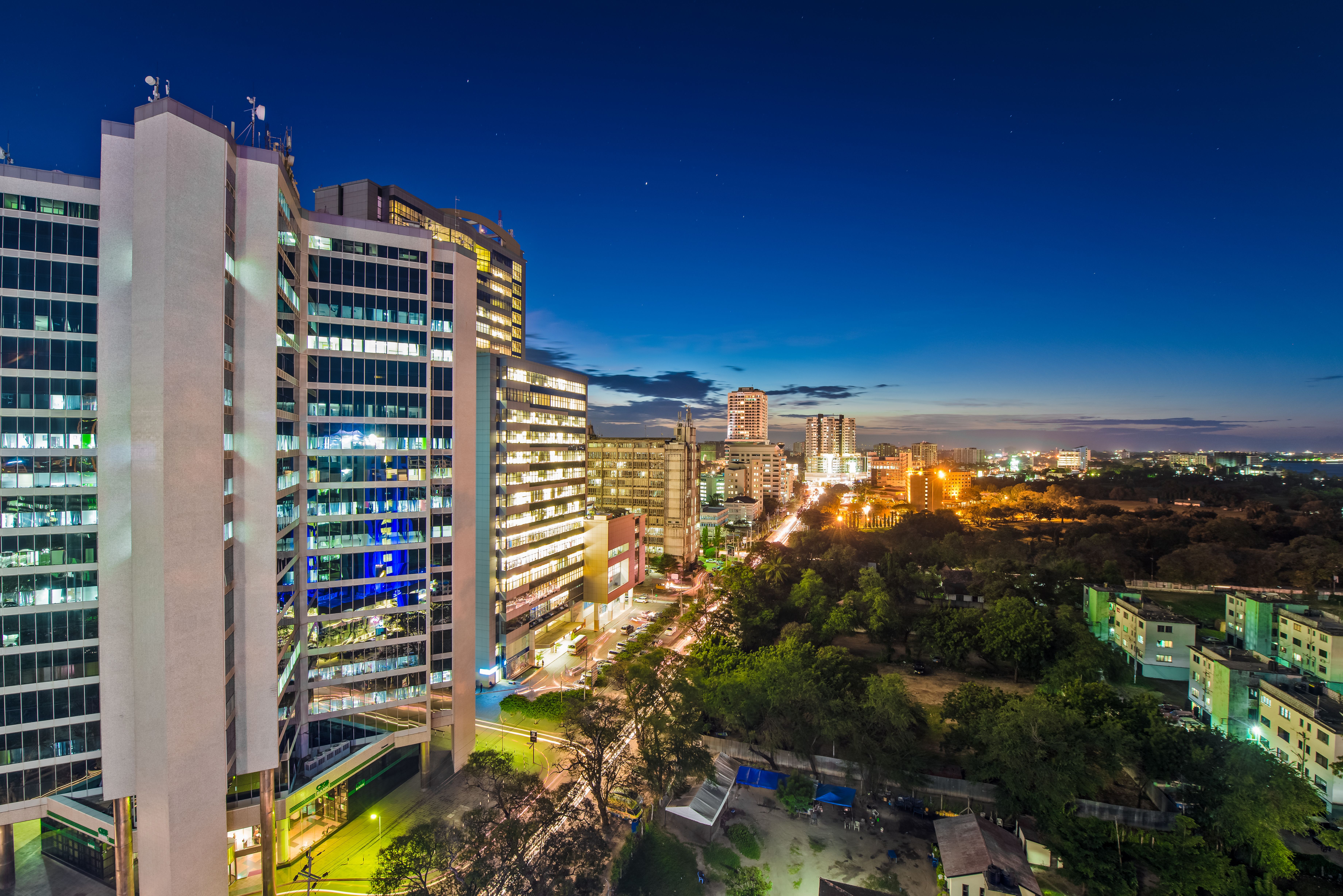 Illustrative financial-district skyline (Dar es Salaam, Tanzania — not a CEMAC location)